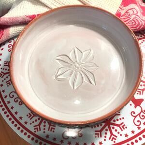 Pie Baker with White Poinsettia in the Center